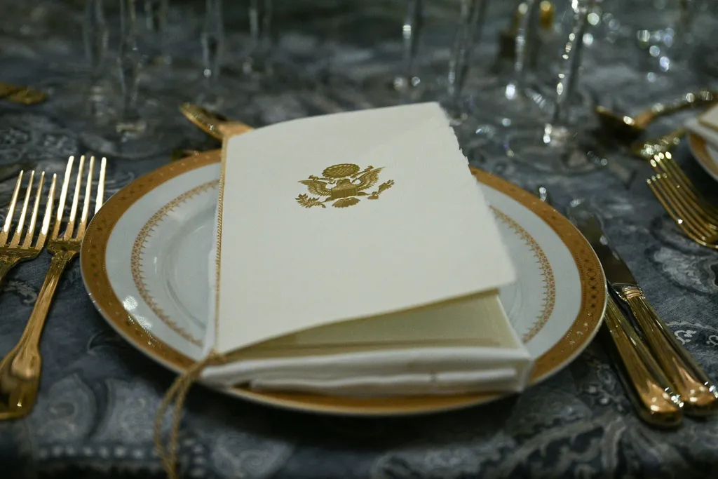 A view of a place setting for the luncheon in Statuary Hall that will follow the inauguration ceremony where Donald Trump will sworn in as the 47th US President in the US Capitol Rotunda in Washington, DC, on January 20, 2025. (Photo by Brendan SMIALOWSKI / AFP)