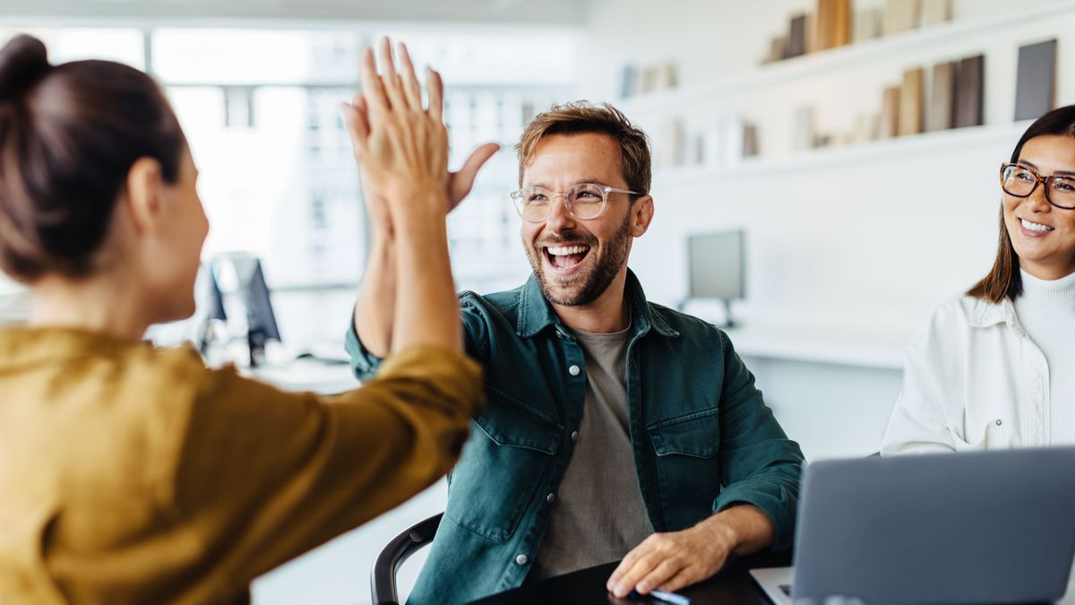 Successful,Business,People,Giving,Each,Other,A,High,Five,In