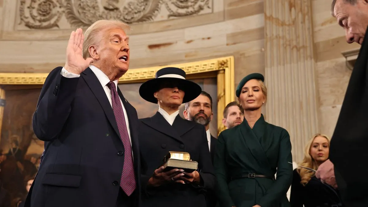 US President-elect Donald Trump takes the oath of office from US Supreme Court Chief Justice John Roberts as Melania Trump and daghter Ivanka look on during inauguration ceremonies in the Rotunda of the US Capitol on January 20, 2025 in Washington, DC. Donald Trump takes office for his second term as the 47th president of the United States. (Photo by Chip Somodevilla / POOL / AFP)