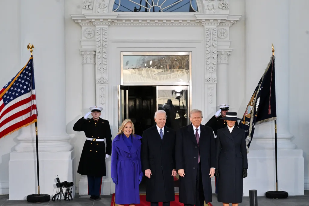 US President Joe Biden, First Lady Jill Biden poses with President-elect Donald Trump and wife Melania Trump as they arrive at the White House in Washington, DC, on January 20, 2025, before departing for the US Capitol where Trump will be sworn in as the 47th US President. (Photo by ROBERTO SCHMIDT / AFP)