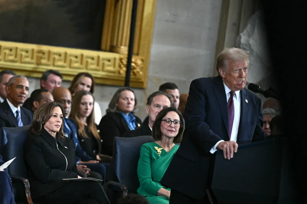 Former US Vice President Kamala Harris (L) listens to US President Donald Trump deliver his inaugural address after being sworn in as the 47th president of the United States inside the Rotunda of the US Capitol in Washington, DC, on January 20, 2025. (Photo by Brendan SMIALOWSKI / AFP)