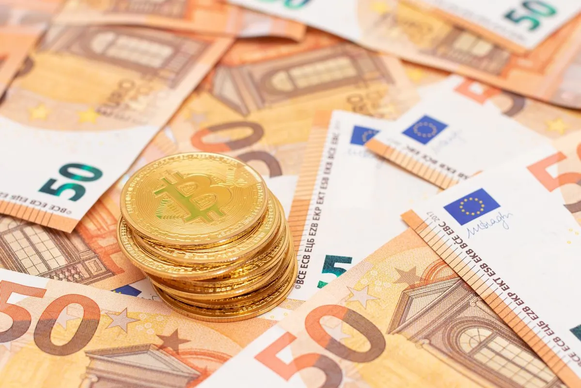 A,Stack,Of,Bitcoin,Coins,On,The,50,Euro,Banknotes.