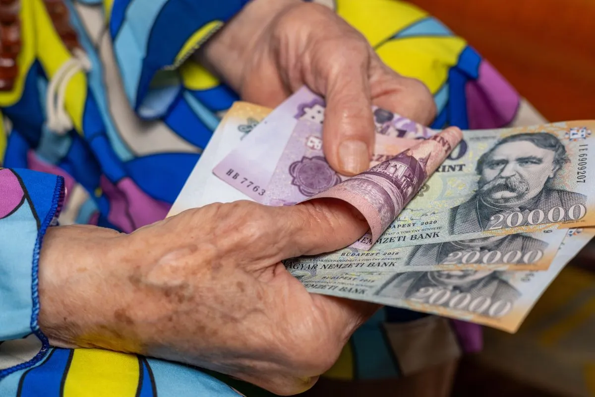 Hungary,Money.,Senior,Woman,Holding,Hungarian,Forints,In,Her,Hands.