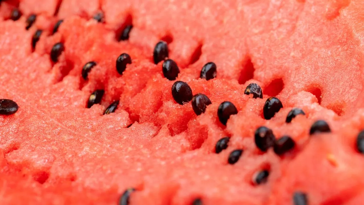 A,Large,Number,Of,Black,Seeds,In,A,Red,Ripe