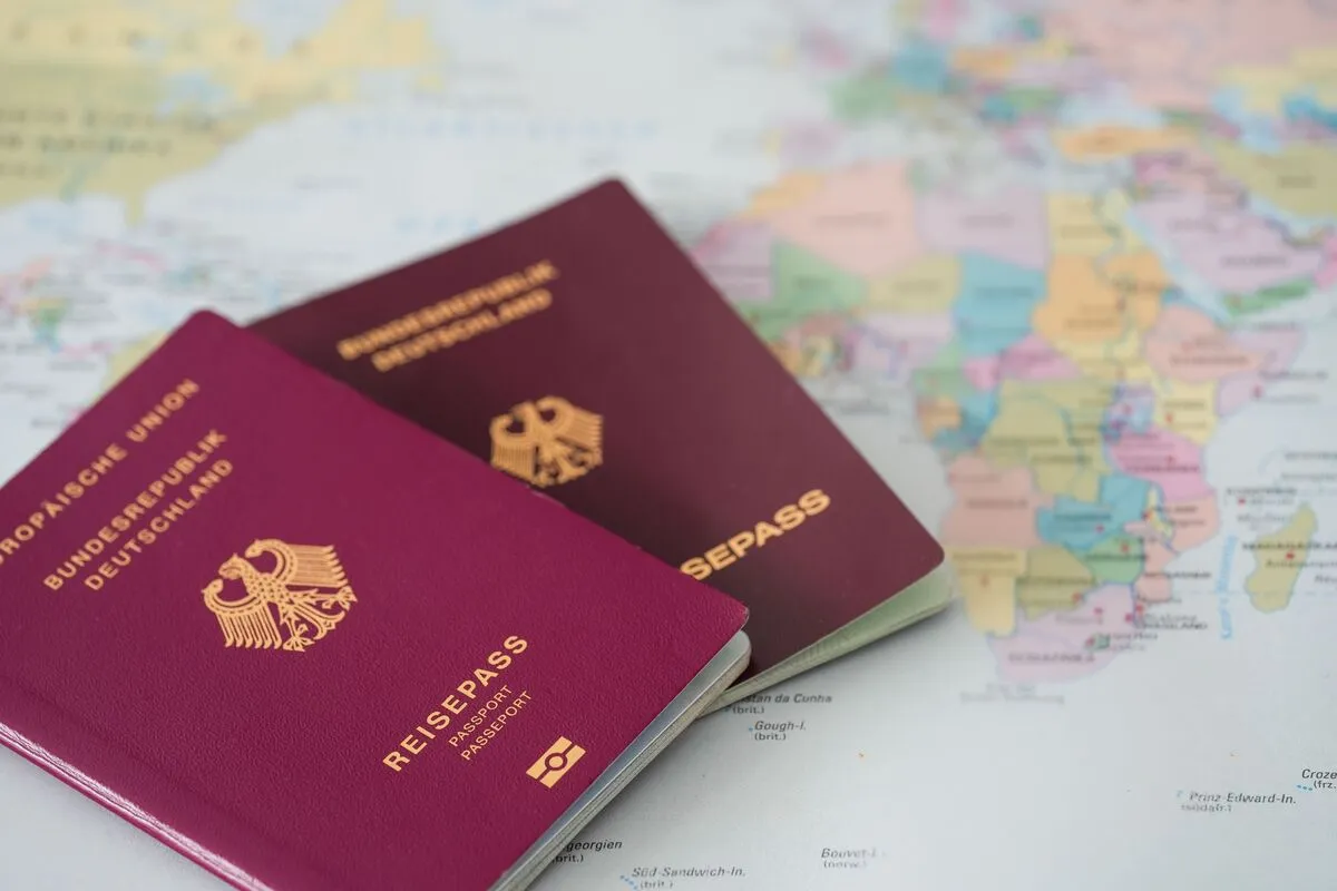 A,Closeup,Shot,Of,Two,German,Passports,On,World,Map, külföldi nyaralás, útlevél,