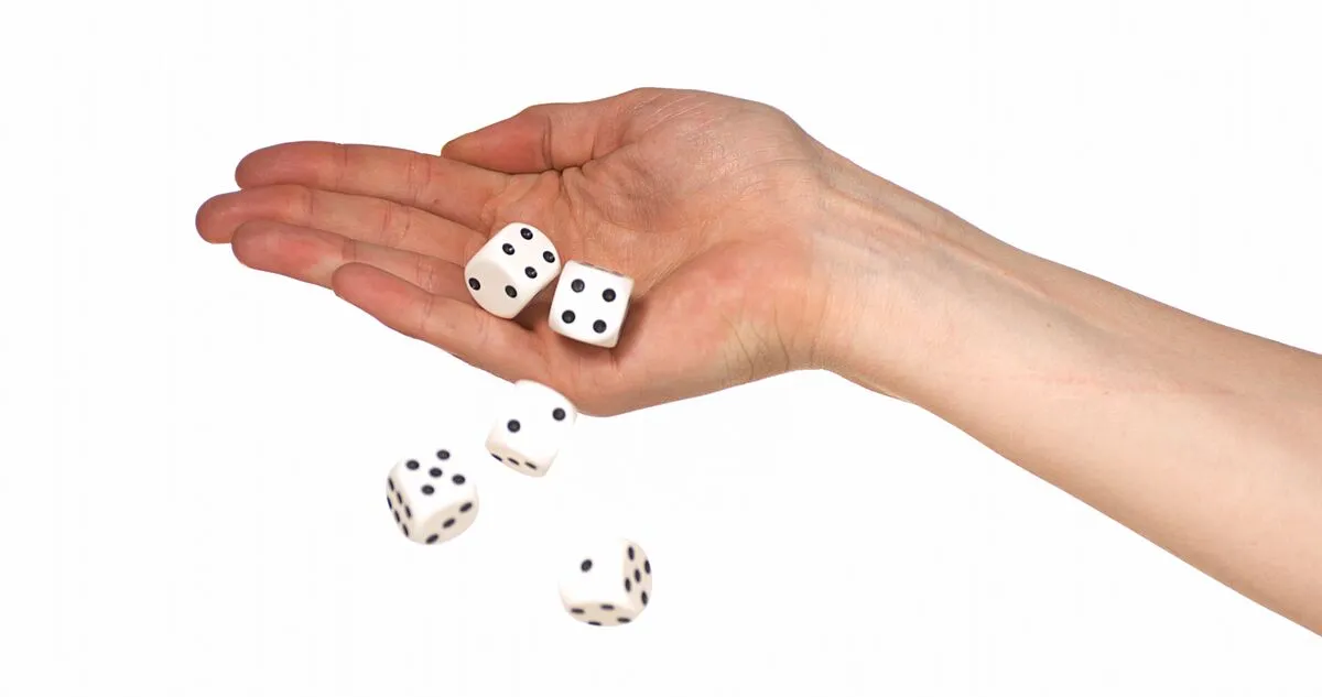 4 csillagjegy Hand,Of,Woman,Throwing,Dice,Against,White,Background