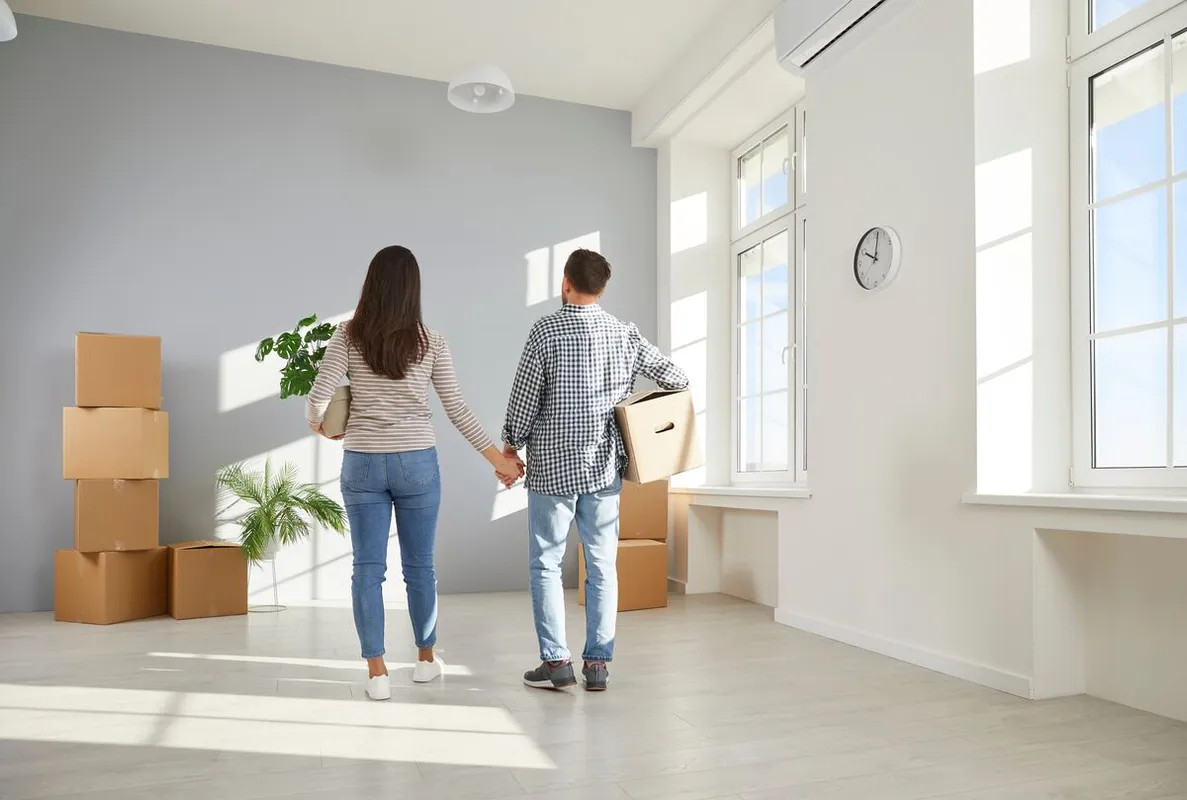 Young,Family,Starting,New,Life,At,New,Home.,Couple,Moving