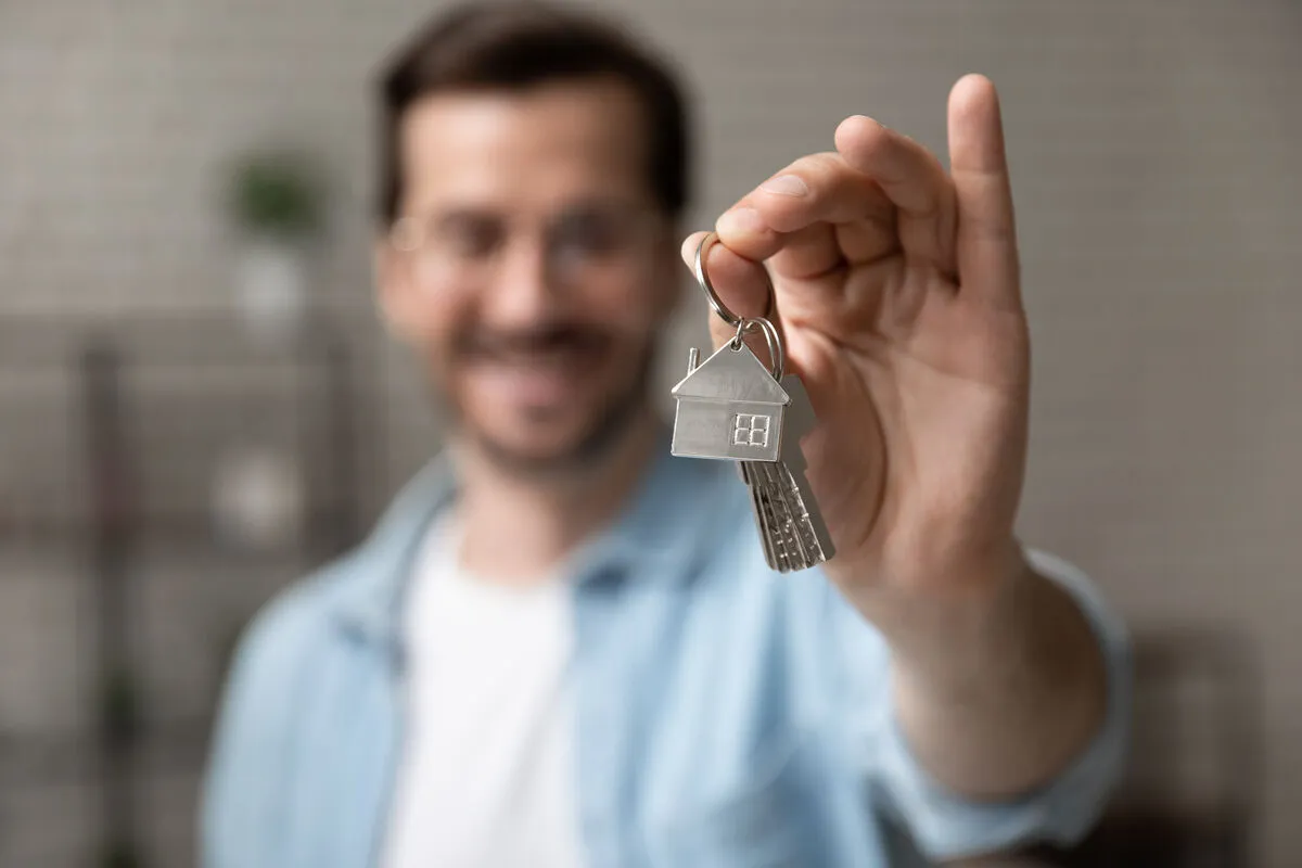 Otthon Start Program, Satisfied,Homeowner.,Blurred,Portrait,Of,Happy,Young,Man,Buyer,Renter