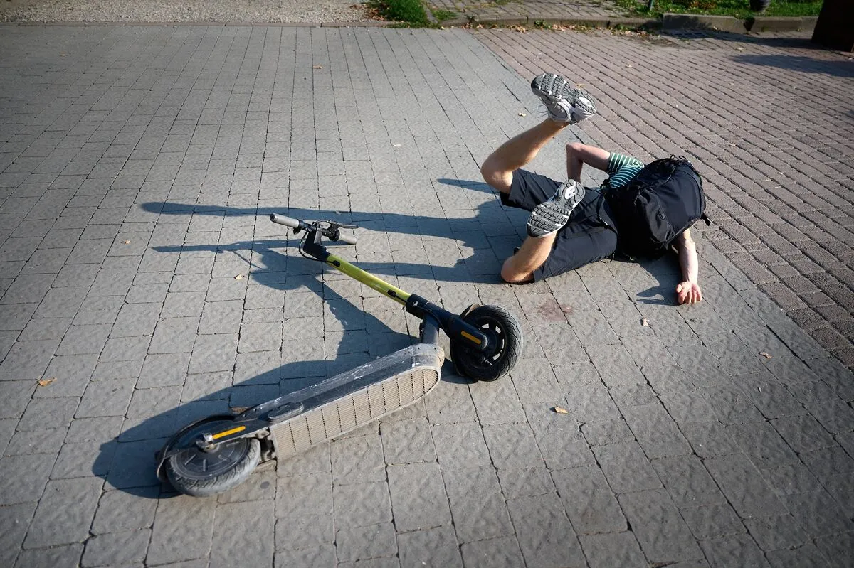 Careless,Man,Felt,Down,From,Electric,Scooter.,Young,Male,Lying