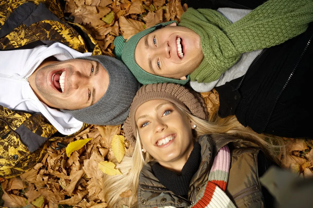 Merkúr Attractive,Young,People,Laying,On,Ground,Among,Autumn,Leaves,,Smiling,