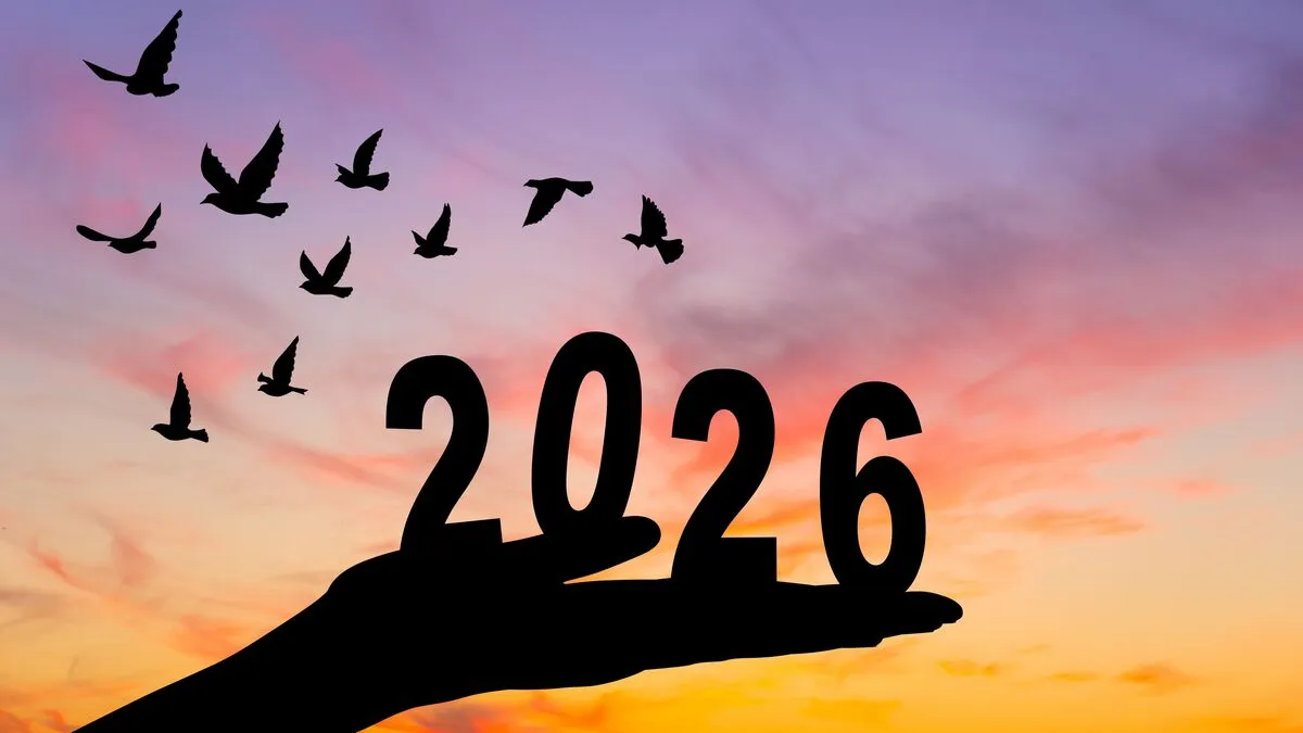 2026 A,Silhouette,Of,A,Hand,Lifting,The,Number,2026,Against