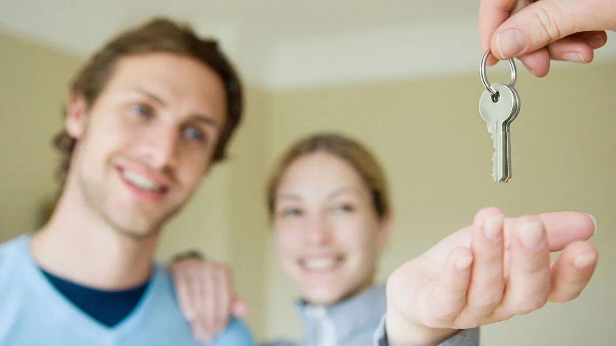 Couple taking keys