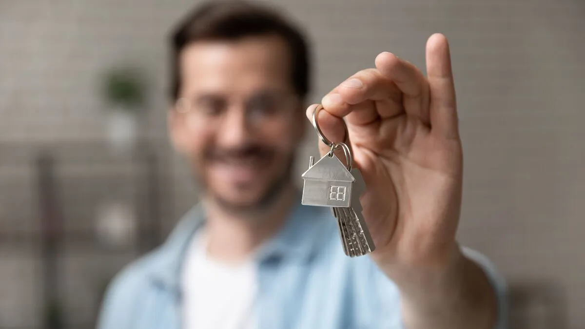 Satisfied,Homeowner.,Blurred,Portrait,Of,Happy,Young,Man,Buyer,Renter