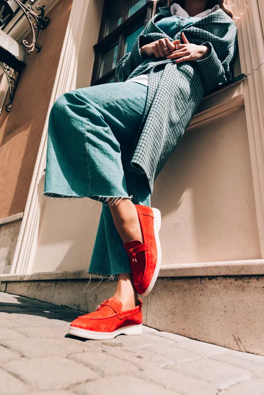 Woman,In,A,Red,Stylish,Suede,Loafer,Shoes,,Blue,Jeanse,