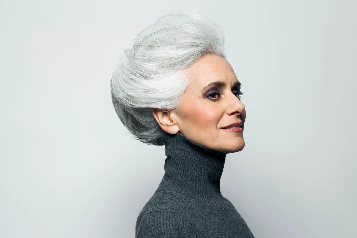 Te jó ég! Micsoda frizura! Grey haired woman in grey turtleneck sweater.