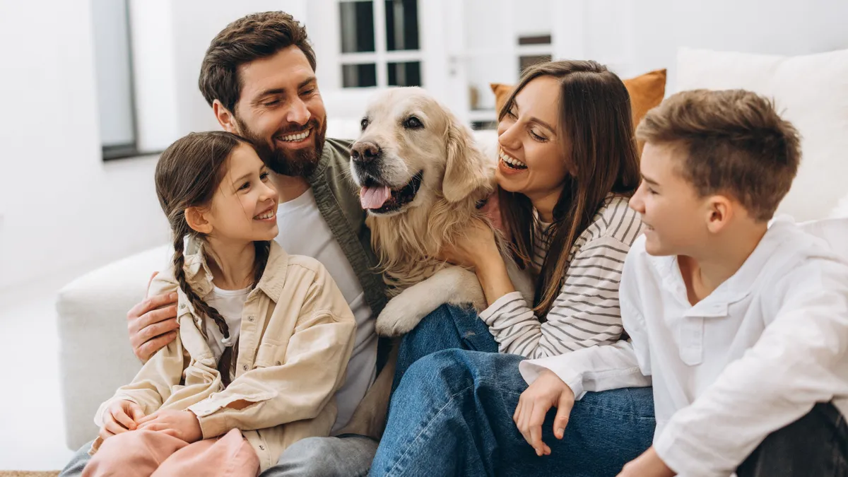 Family,Enjoying,Quality,Time,Together,,Embracing,And,Laughing,With,Their