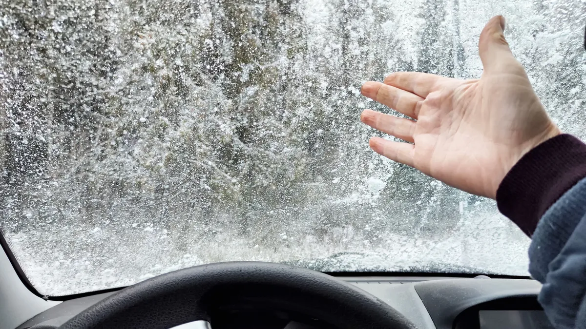 Autó ablak A,Hand,Points,Out,Frost,Covering,The,Car,Window,While