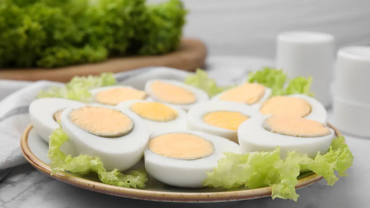 Fresh,Hard,Boiled,Eggs,And,Lettuce,On,White,Marble,Table