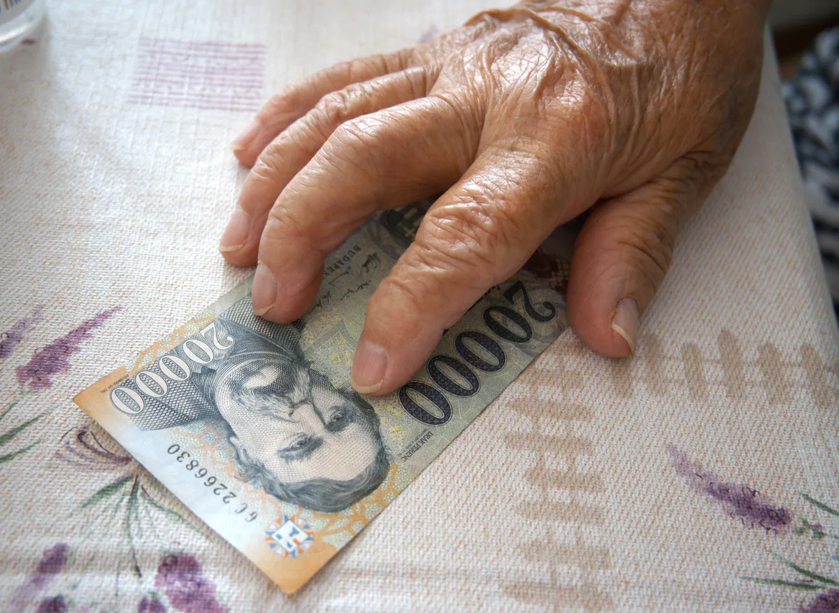 Close-up,Of,An,Elderly,Woman's,Hand,Holding,A,Hungarian,20000