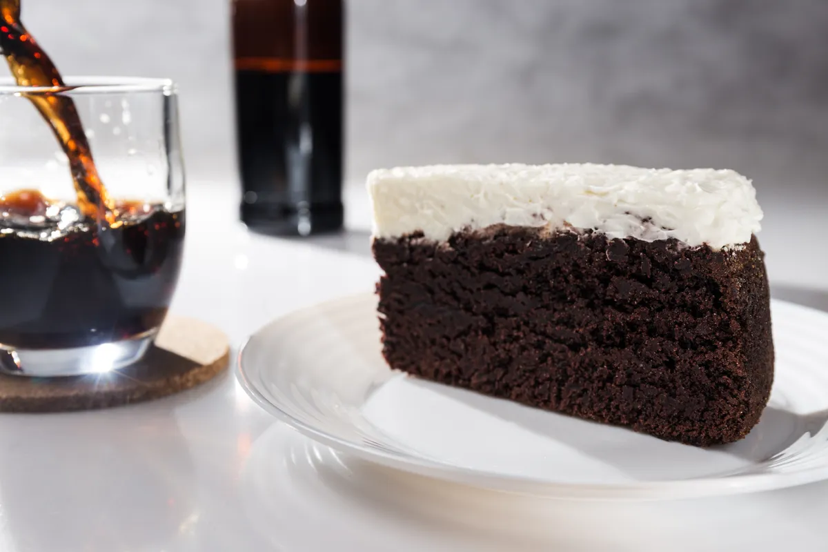 Portion,Of,Chocolate,Cake,And,Black,Beer,On,White,Background
