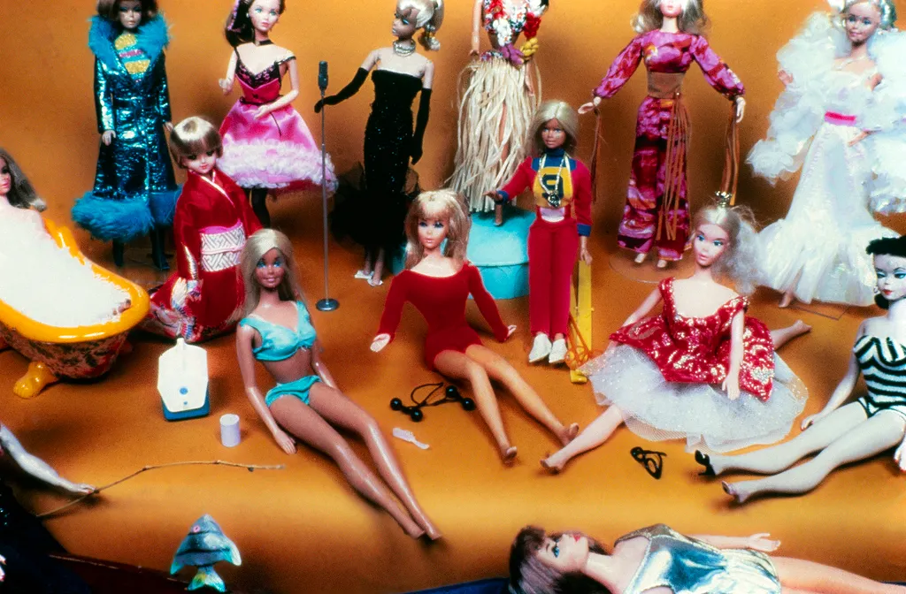 group of barbie dolls from 1975