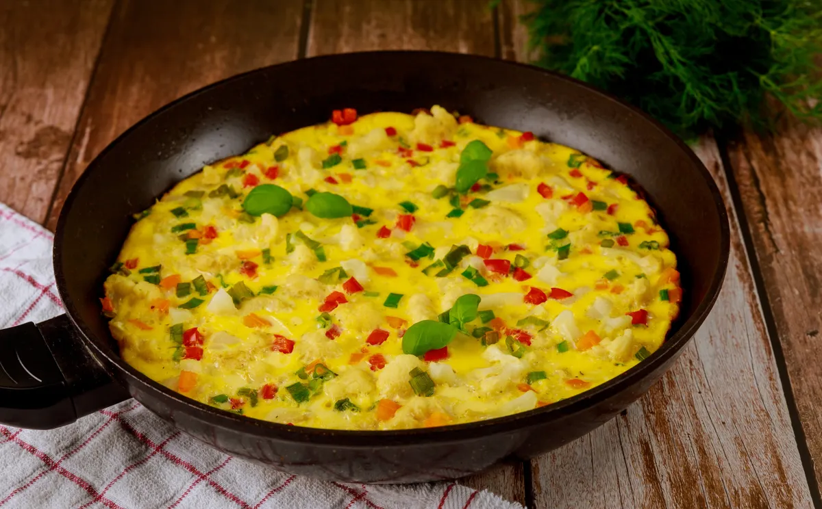 Rántotta Vibrant,Vegetable,Omelette,Being,Prepared,In,Black,Frying,Pan,,Featuring