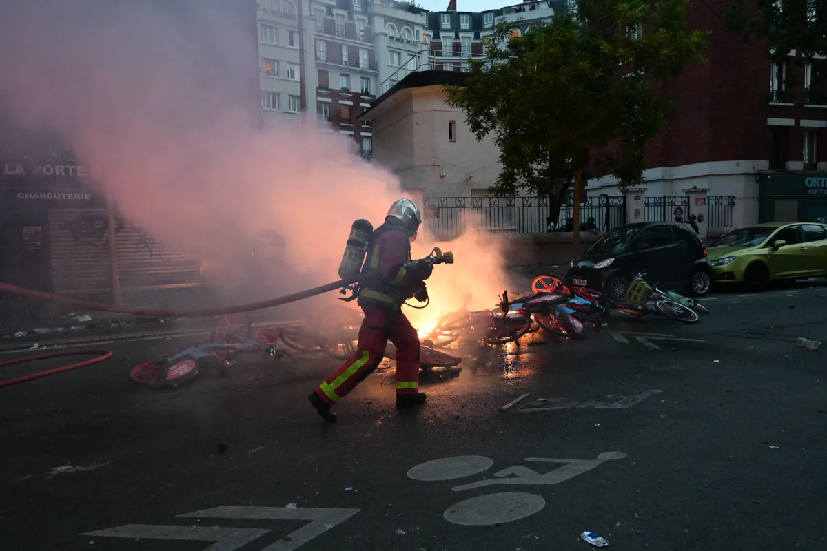 PSG fans clash with police in Paris during UEFA Champions League victory celebrations