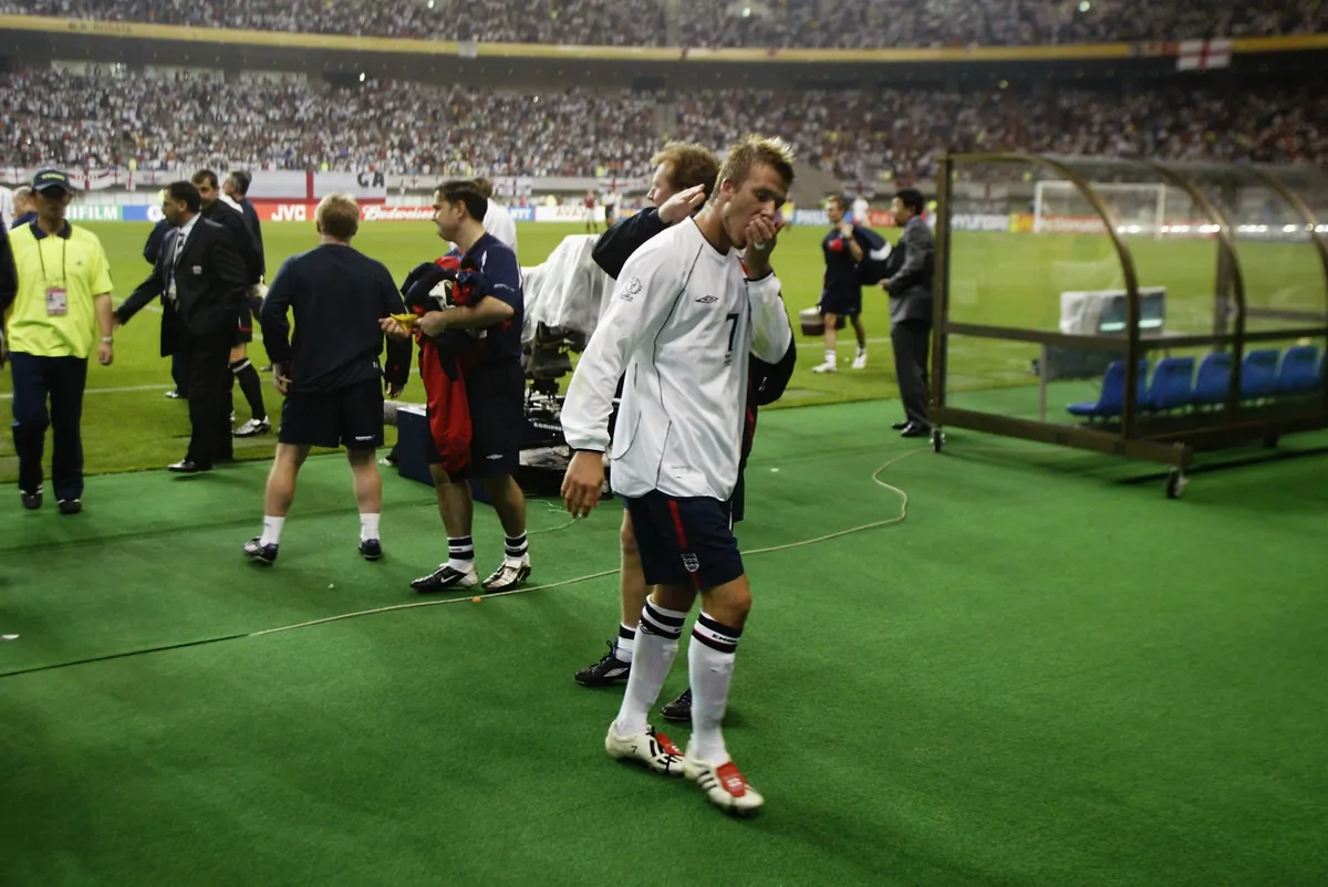 David Beckham of England leaves the field